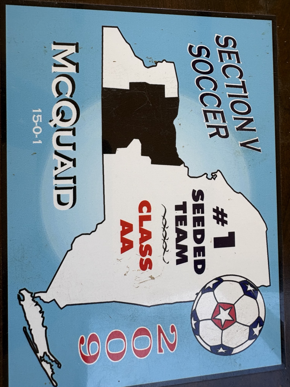 Placa de McQuaid, cabeza de serie número 1 de fútbol de la Sección V en Class AA, 2009